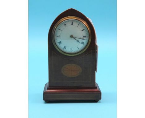 An Edwardian inlaid mahogany mantel clock, lancet-shape with convex dial and French movement, 9.5in.