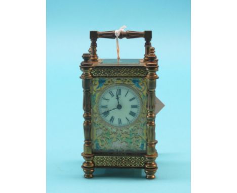 An early 20th century French mantel clock, dial with inset coloured filigree, timepiece movement with key, 6in.
