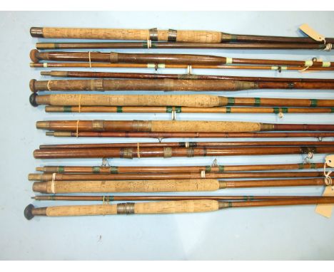 A collection of nine vintage greenheart boat rods, a whole cane beach caster rod and other rods, (19).