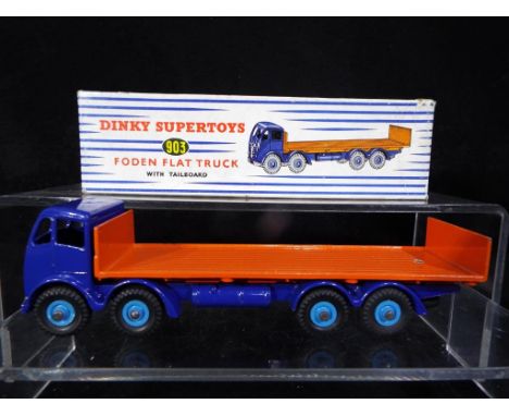 Dinky Supertoys - A boxed Dinky Supertoys # 903 Foden Flat Truck with Tailboard, dark blue cab and chassis, orange flatbed an
