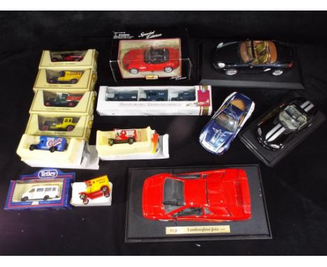 Maisto, Matchbox and others - 14 predominately boxed diecast model vehicles in various scales. Lot includes Maisto Lamborghin