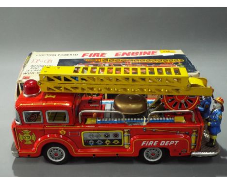 Kokyu - A boxed Vintage Japanes Friction Powered F6 Fire Engine by Kokyu - features pop up 3 way ladder and bell. Model appea