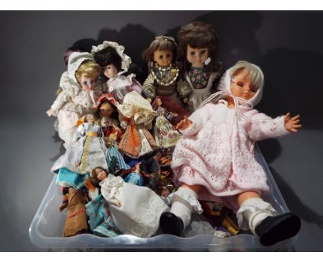 A good collection to include a large collection of international souvenir dress dolls, four ceramic faced dolls and two simil