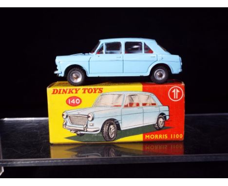 Dinky Toys - A boxed Dinky Toys 140 Morris 1100. The model has a light blue body with red interior with chrome spun hubs. The