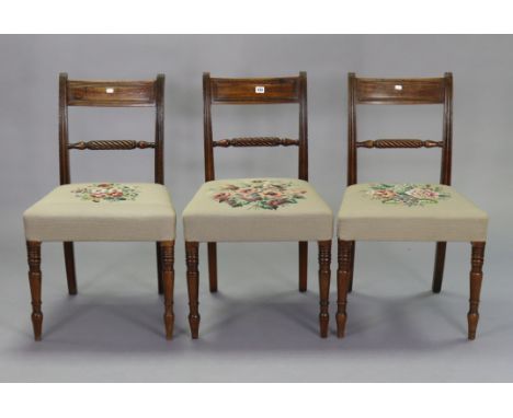 A set of three 19th century mahogany bow-back dining chairs with padded seats, &amp; on ring-turned tapered legs. 