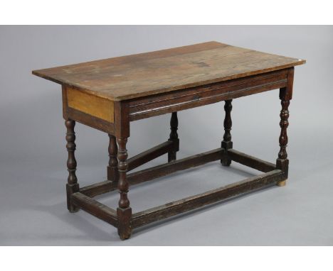 A 17th century &amp; later oak side table with three board rectangular top, an additional drop-leaf to one side supported by 