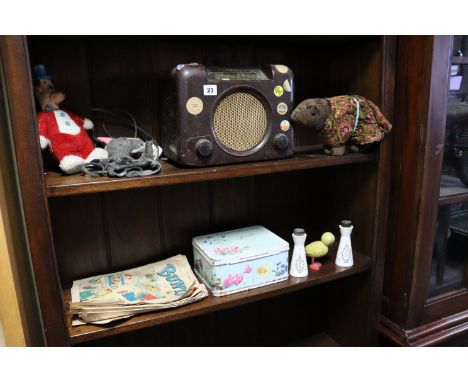 A Bush valve radio in a brown bakelite case; together with two soft toys; a hand puppet, etc. 