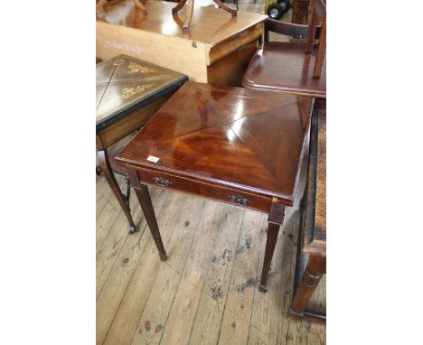 An Edwardian mahogany envelope folding card table