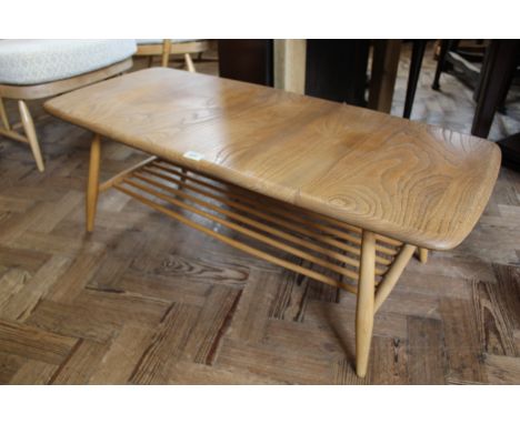 A mid Century blonde teak Ercol coffee table with under tier