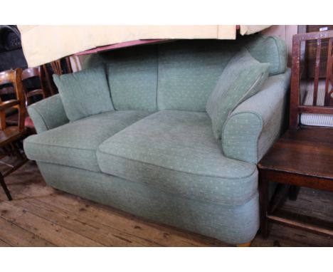 A modern pale green upholstered sofa bed, in very good condition