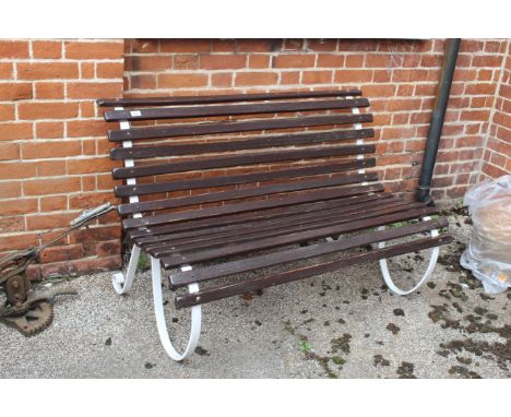 A teak and white iron garden bench of small proportions