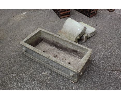 A concrete planter on plinths