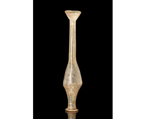 Imperial period, Ca. 200-300 AD.A light-yellow glass vessel. The glass has an small lip and an everted rim leading to a long 