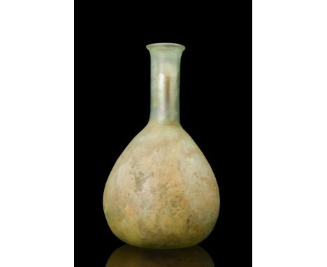 Ca. 100-200 AD.A light blue-green blown glass bottle with a teardrop shaped body. It also has a long cylindrical neck and fla