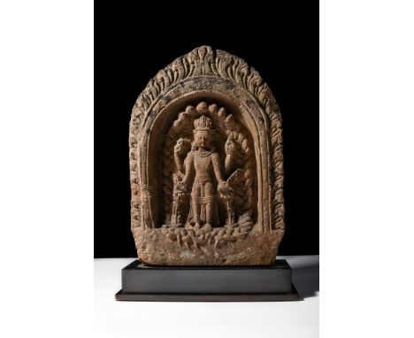 Ca. 400-600 AD.A stone panel that showcases Vishnu in an elegant, arch. He is depicted with four arms, two lying at his sides