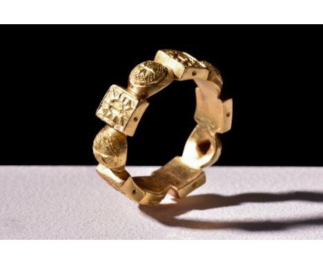 Ca. 1400-1500 AD.A gold ring consisting of ten interconnected plaques – five circular and five rectangular. The circular bead