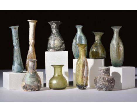 Ca. 100-300 AD.A set of 10 distinctly shaped glass vessels used to store perfumed oil, or unguents. The shapes in this lot va