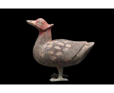Ca. 202 BC - 220 AD.A polychrome terracotta figure of a duck, with lifelike legs. It has colourful feathers, a red head with 