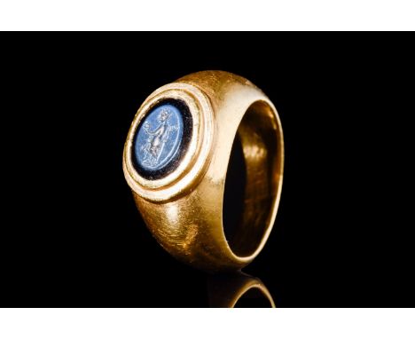 Ca. 100-200 AD.A gold ring with an oval nicolo intaglio depicting Fortuna, a Roman deity symbolising destiny and luck. The ri