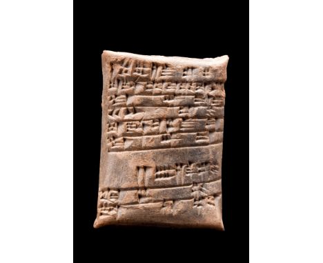 Ca. 1900 BC.A rectangular ceramic tablet with sharp corners and visible cuneiform on one side. Tablets such as this one were 