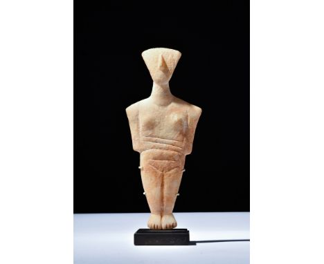Cycladic II, Keros-Syros culture, ca. 2800-2300 BC.A female idol made from white marble with yellow-orange patina and concret
