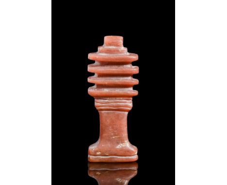 New Kingdom, Ca. 1550 BC-1069 BC.A Djed pillar amulet made from carnelian, symbolising stability in ancient Egyptian culture.