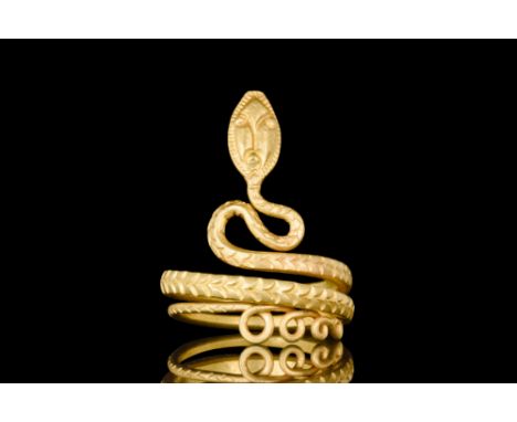 Ca. 100 BC-100 AD.A snake-shaped finger ring, meticulously crafted from a single piece of gold wire, tapering from tail to he