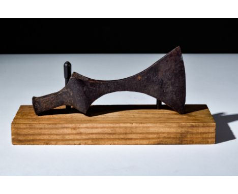 Ca. 900-1100 AD.An iron axe head with a sharp, curved blade for effective combat. The tapering cheek adds strength and balanc