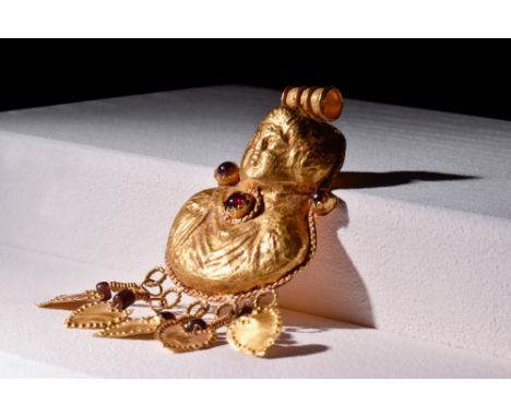 Ca. 300 BC-100 AD.A striking Greco-Roman gold pendant possibly depicting the Greek god Eros. The pendant features a suspensio