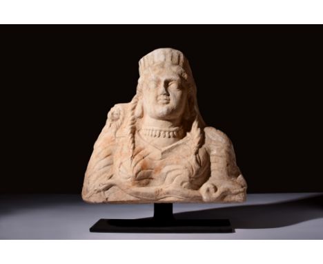 Eastern Mediterranean, Ca. 200-400 AD.A carved bust depicting a woman wearing draped garments and with her hair arranged in l