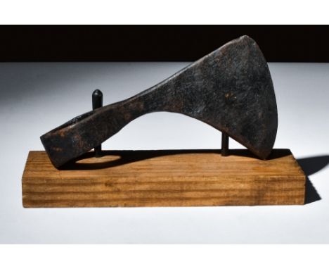 Ca. 900-1100 AD.An iron axe head with a curved cutting edge for versatile and efficient cutting. The tapering cheek adds bala