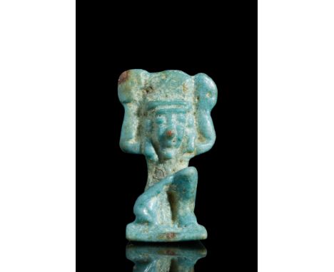 Late Period, Ca. 664-332 BC.A light blue faience amulet depicting Shu, the air god, in a kneeling pose with one knee touching