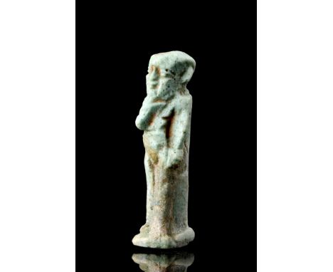 Ca. 664-332 BC.A light blue glazed faience amulet representing the Harpocrates, also known as Horus the child. The god stride