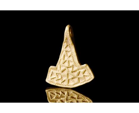 Ca. 900-1000 AD.A gold pendant shaped like a flat, double-headed hammer. This design is connected to 'Mjollnir,' the famous h