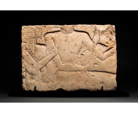 New Kingdom, XIX Dynasty, Ca. 1290-1213 BC.A limestone relief fragment sculpted in sunken relief, depicting a couple. The wom