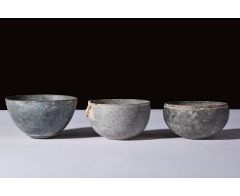 Ca. 3000-2000 BC.A set of three stone bowls with hemispherical bodies, smooth walls, and pronounced rims the pieces are beaut