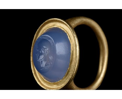 Ca. 100 BC.A sapphire intaglio in a gold ring displaying a detailed portrait of Athena, the Greek goddess of wisdom and war, 