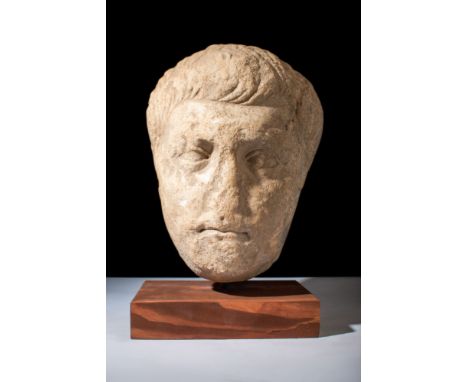 Ca. 100-200 AD.A marble head dating from the Trajanic/Hadrianic period. The nobleman's face exhibits the characteristic styli