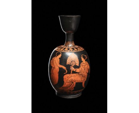 Iliupersis Painter, Ca. 370-360 BC.A red-figure pottery lekythos depicting a young seated woman wearing a drapery garment and