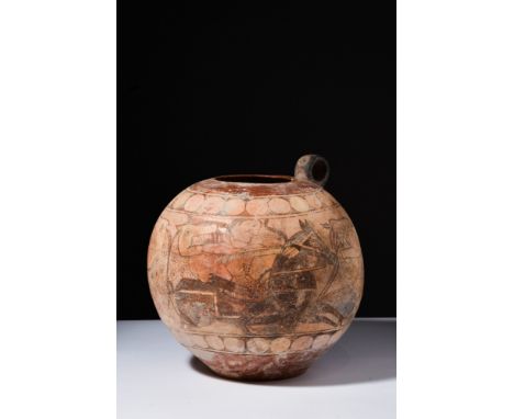 Ca. 1100-1200 AD.A pottery storage jar of rare form. The vessel features a wide spherical-shaped body with a narrow disc foot