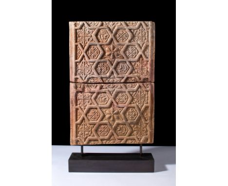 Ca. 1100-1200 AD.A pair of rectangular terracotta decorative tiles. The upper surface has an intricately designed central ros