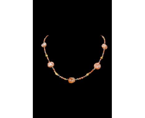 Ca. 1000 BC.A restrung Western Asiatic necklace consisting of large conical shaped carnelian beads with cross hatch decoratio