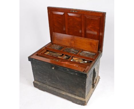 Late Victorian tool chest, the black painted exterior with iron carrying handles and banding, the hinged lid with panelled in