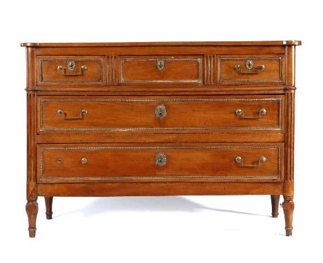 Louis XVI French chestnut commode, late 18th Century, the rectangular top with projecting corners above rounded fluted corner