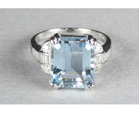 An 18ct white gold aquamarine and diamond ring - the emerald cut central stone with diamond set shoulders, size M, 5.5g