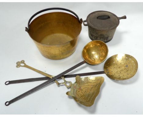 A 19th century brass jam pan - with an iron hoop handle, together with a brass ladle with iron handle, two further brass spat