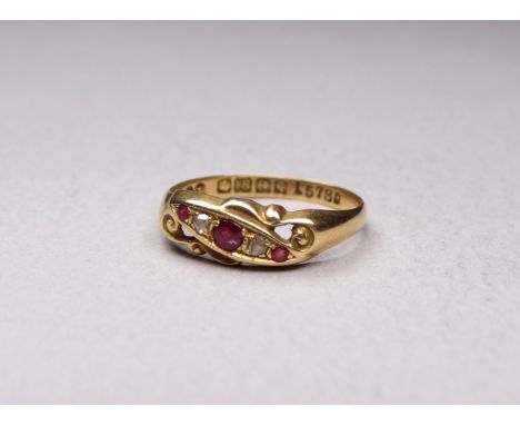 An 18ct gold diamond and spinel set ring - size O, weight 2g.