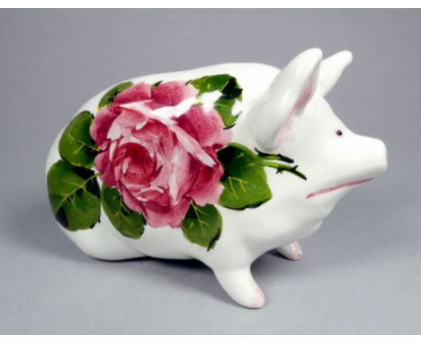 A Wemyss ware pottery money box pig - decorated with cabbage roses, 17cm wide