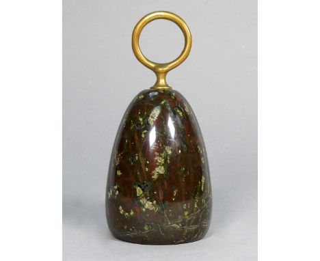 A serpentine doorstop - with brass ring handle, height 16cm.