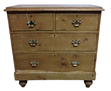 A 19th century pine chest of drawers - the rectangular top above an arrangement of two short and two long drawers on turned b